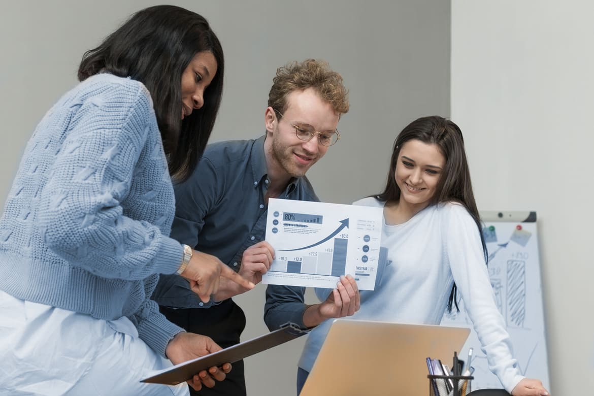 Team collaborating on digital marketing strategy with AI_SEO content optimization tool