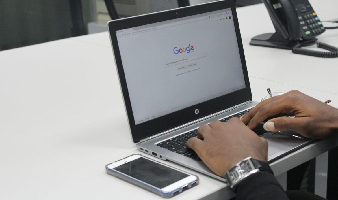 SEO marketing strategies 2025 - person using Google search on laptop