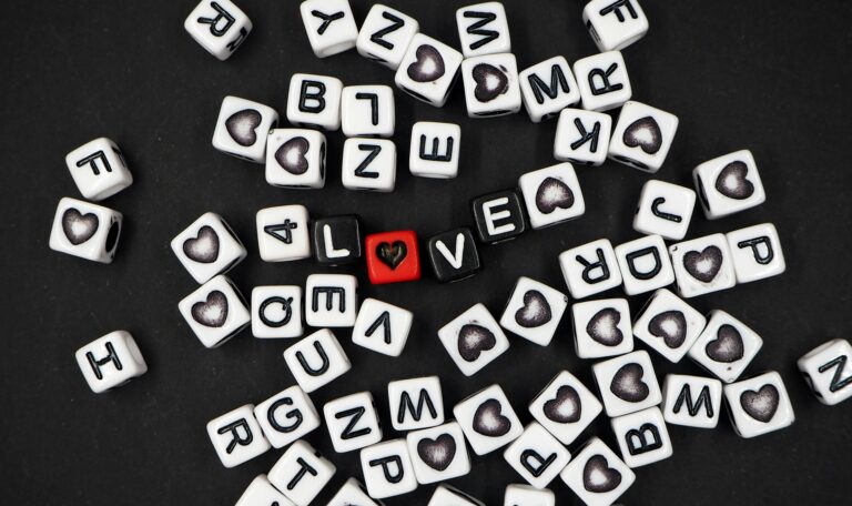 Scattered alphabet blocks on black background symbolizing SEO audit and consulting