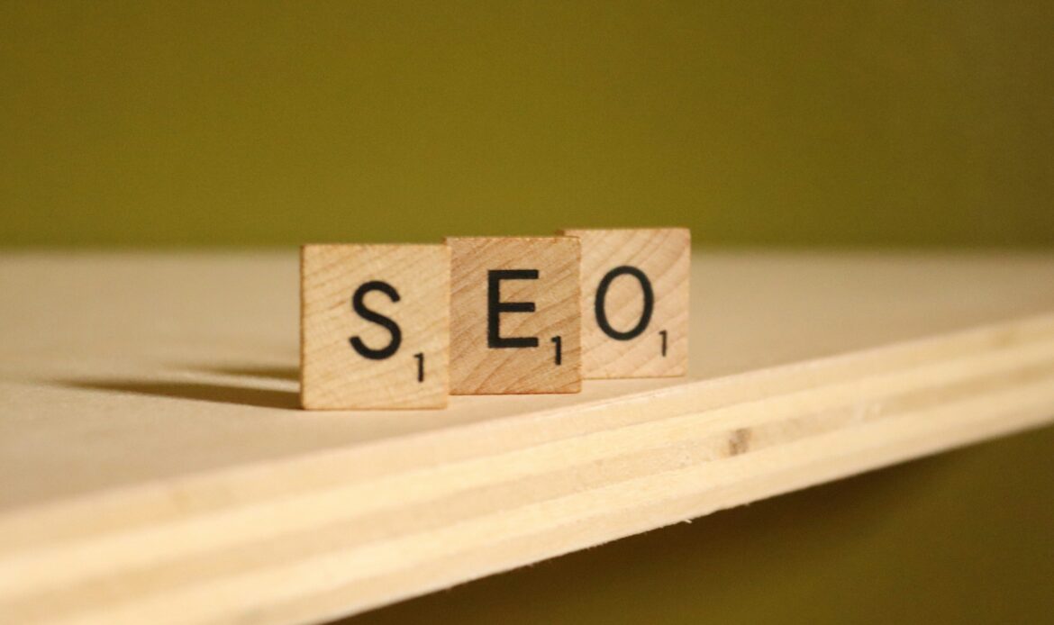 SEO services concept with wooden letter blocks spelling SEO