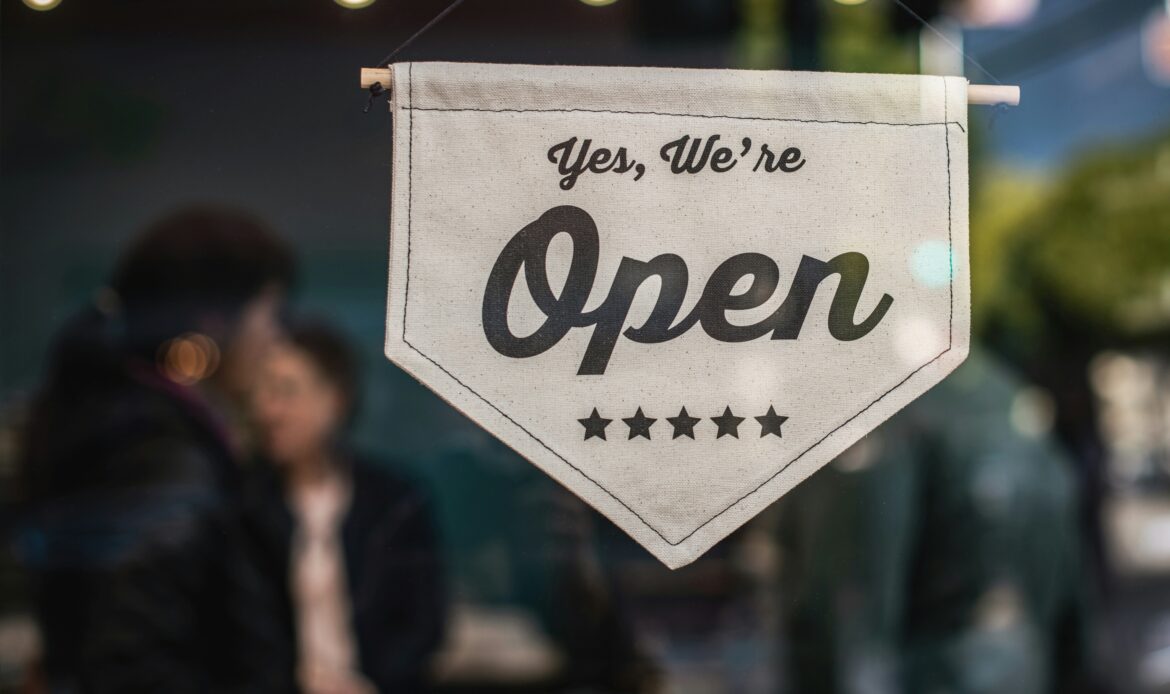 SEO for small businesses in 2025 — local shop open sign showing online visibility and growth