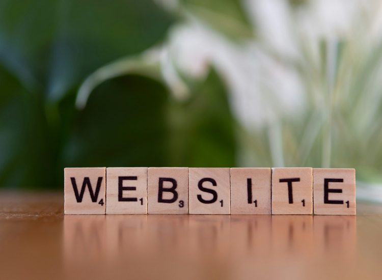 Website spelled with Scrabble tiles, representing SEO audit and consulting services